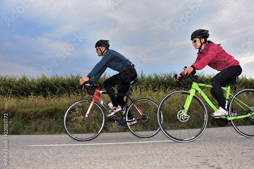 cycling couple on a road