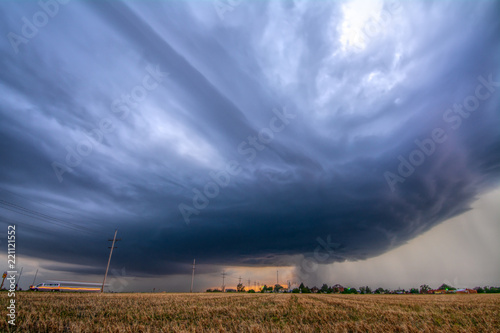 Rotating, tornado-warned storm develops pretty striations over Collyer, Kansas photo