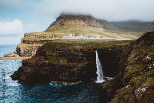 Coastal cliff with waterfall