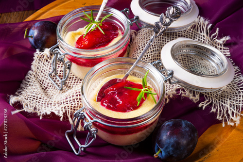 for breakfast fresh semolina pudding with cinnamon and plums photo