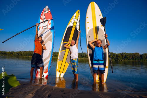 Happy friends with SUP boards