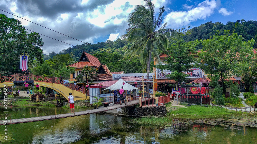 Fototapeta premium A small village and river and walking people in forests, Langkawi, Malaysia
