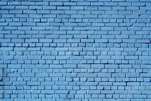 Blue color old grungy brick wall surface.
