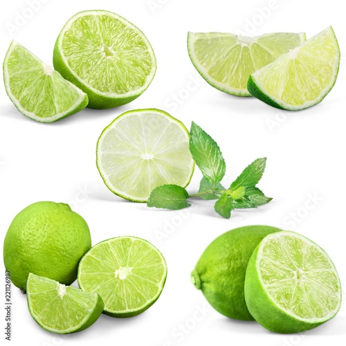 Set of fresh limes isolated on white background