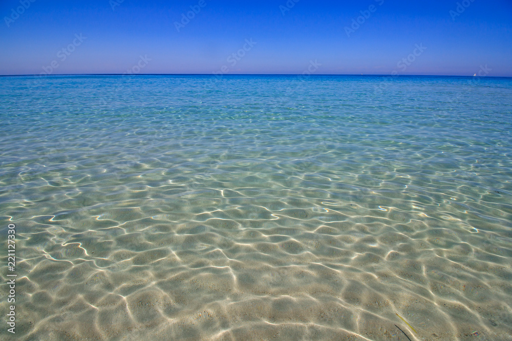 Crystal clear sea view. Pure blue beach water in Corsica