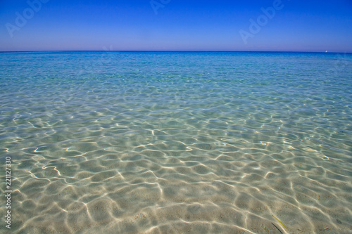 Crystal clear sea view. Pure blue beach water in Corsica