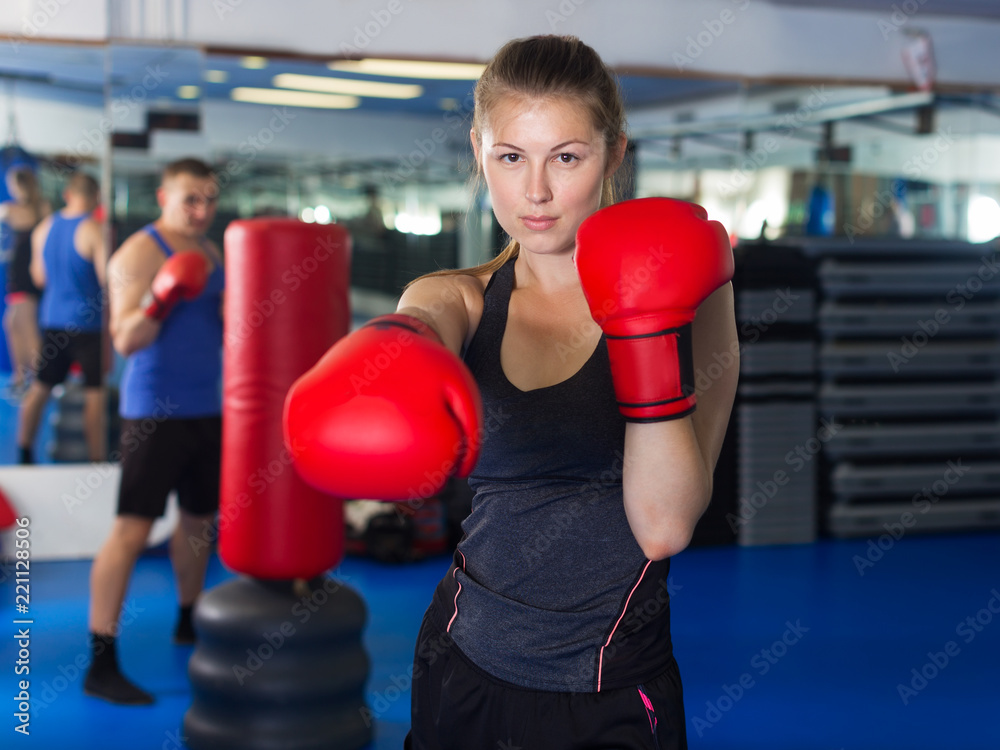 Woman boxing in gym
