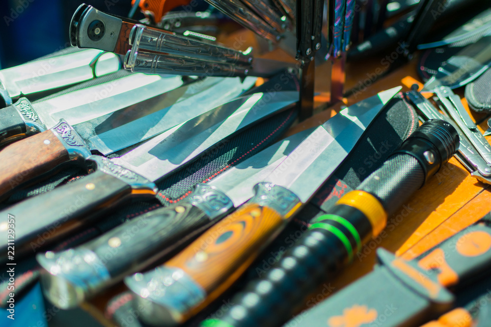 Various knives lying next to each other. Various knives lying next to each other.