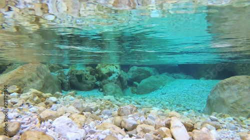 Underwater: Amazing mountain river flow and turquoise water. 60fps, UHD