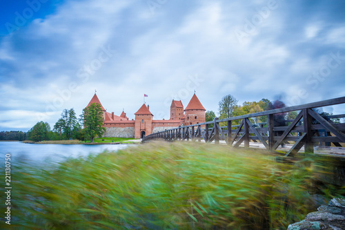Fototapeta Naklejka Na Ścianę i Meble -  TRAKAI / LITHUANIA - OCTOBER 10, 2016: Long exposure shot of ancient medieval castle at the Trakai Island