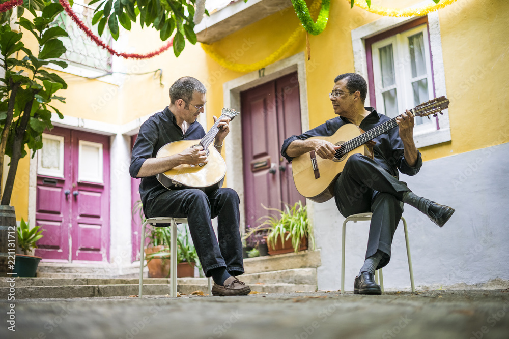 Two fado guitarists with acoustic and portuguese guitars