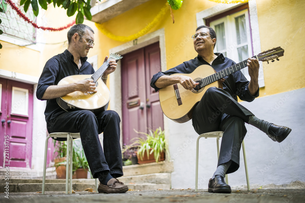 Obraz premium Two fado guitarists with acoustic and portuguese guitars