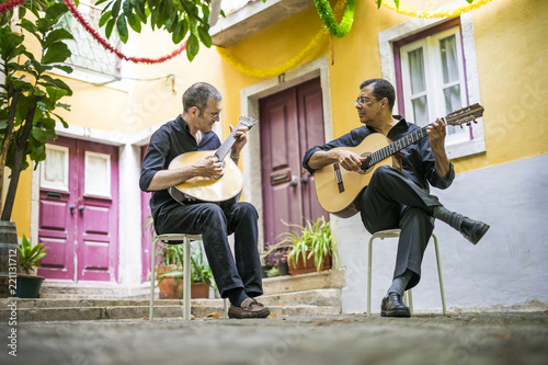 Obraz na płótnie Two fado guitarists with acoustic and portuguese guitars w salonie