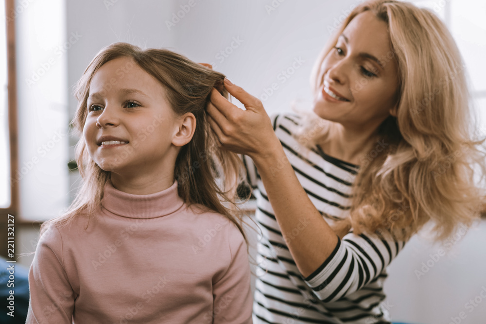 So excited. Pleasant nice girl smiling while waiting for a hairstyle to be done So excited. Pleasant nice girl smiling while waiting for a hairstyle to be done