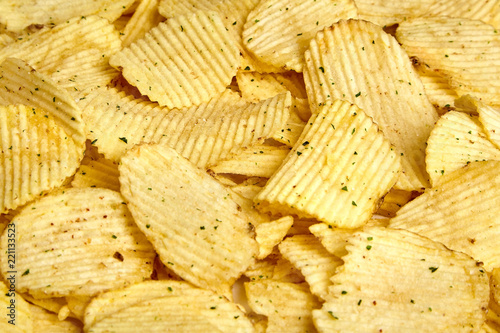 rippled potato chips with condiment