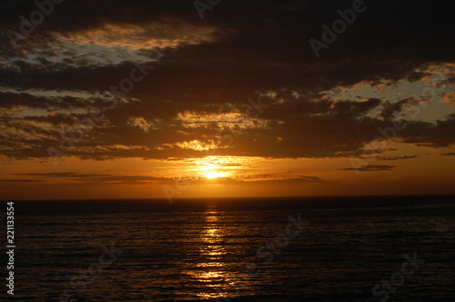The sun setting over the sea, at California