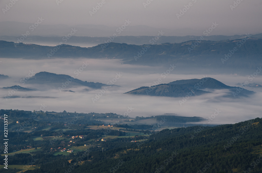 View on a hills in the valley in a morning mist