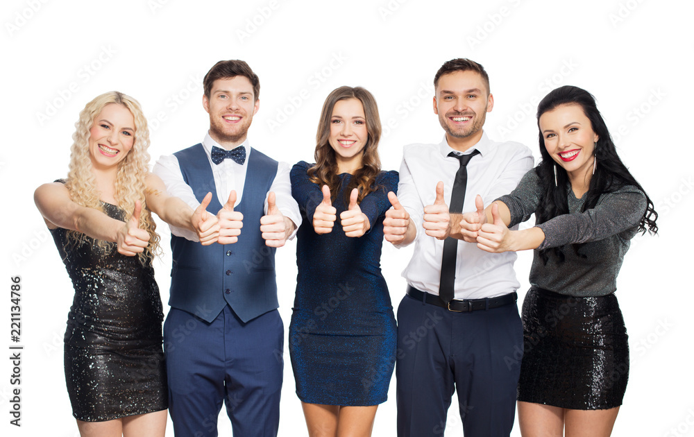 celebration, people and holiday style concept - happy friends in party clothes showing thumbs up