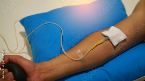close up on patient hand with syringe cable ,doctor and patient concept