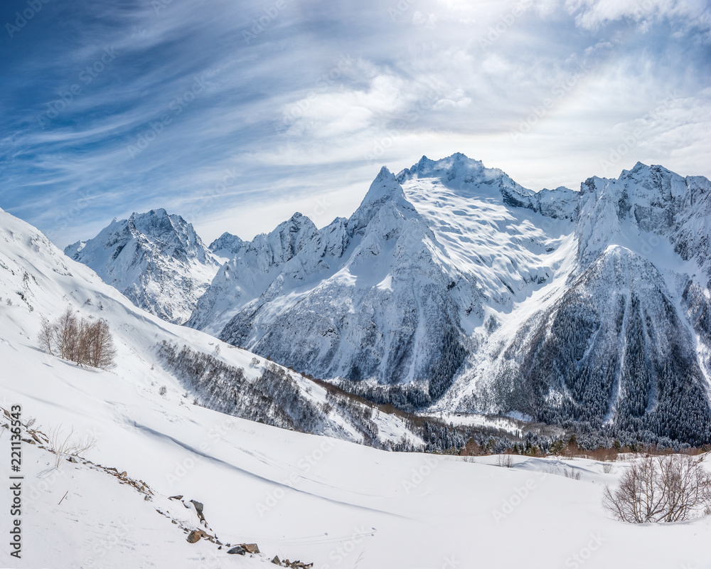 Western Caucasus mountains: Peak Ine, Dzhuguturlyuchat, Amanauz and Sofrudzhu. Winter view from Mussa-Achitara ski slope, Dombai ski resort, Russia.