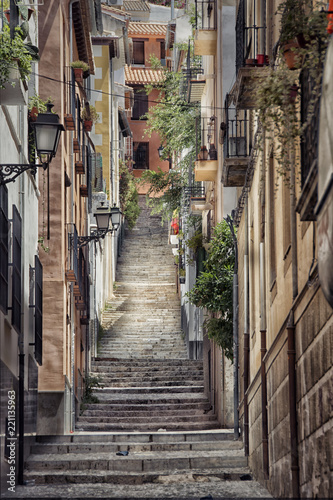 Old street with stairs in Granada in Spain.