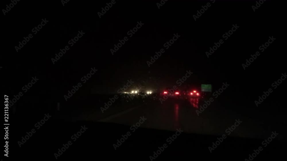 Driving on highway in rain in the evening Driving on highway in rain in the evening