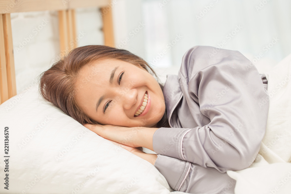Beautiful Attractive Asian woman sleep and sweet dream on bed in bedroom in the morning feeling so relax and comfortable,Healthcare Concept