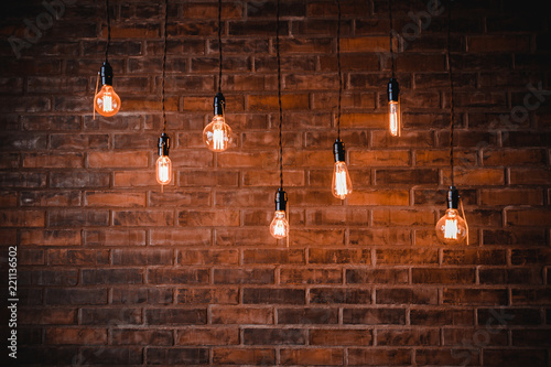 Fotografering Decoration antique edison light bulbs background red brick wall