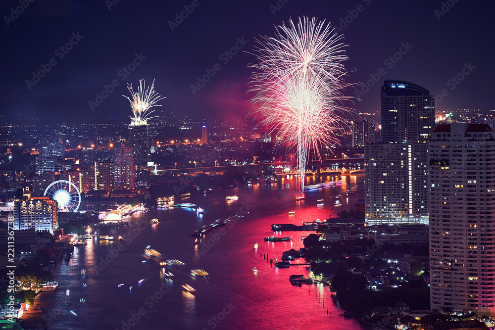 fireworks festival on the river with cityscape on vintage filter color