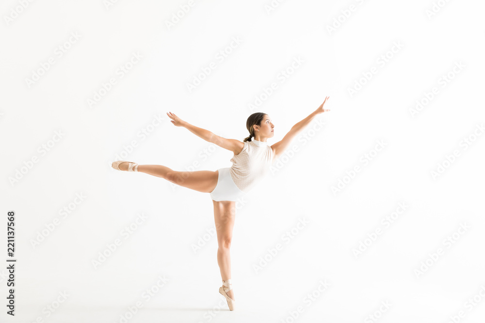 Graceful Ballerina Doing A Ballet Pose Called Arabesques Graceful Ballerina Doing A Ballet Pose Called Arabesques