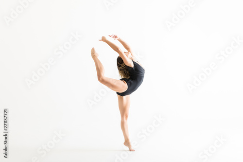 Ballerina In Black Leotard Practicing Ballet Moves
