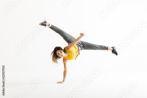 Attractive Young Woman Doing A Freeze Breakdance Move