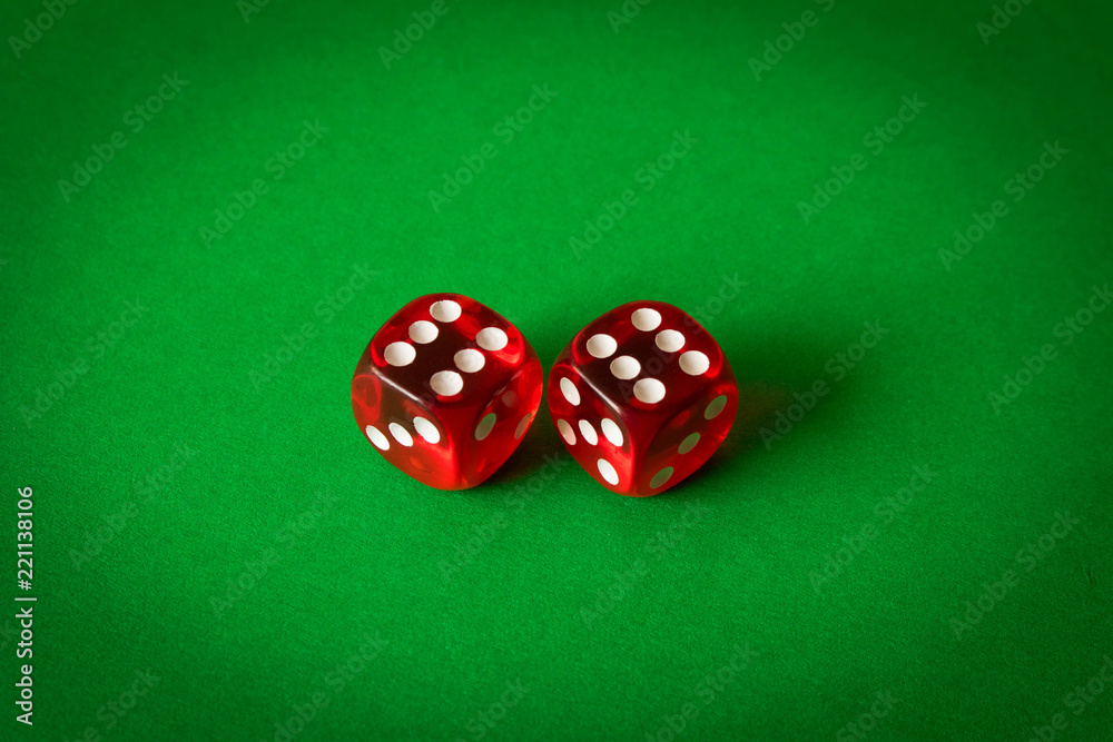 Dice on a green background . Game concept. Games of chance Dice on a green background . Game concept. Games of chance