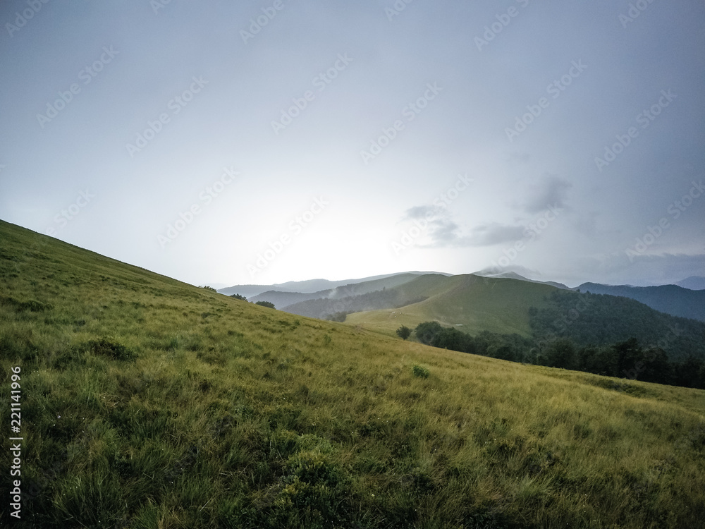 The summer green Carpathian mountains in Ukraine. The sky is over the mountains. Atmospheric landscapes while traveling on a jeep. Offroad expedition