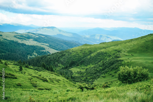 The summer green Carpathian mountains in Ukraine. The sky is over the mountains. Atmospheric landscapes while traveling on a jeep. Offroad expedition