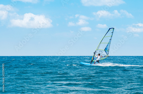 Phuket Patong beach windsurfing sport in hot summer sun