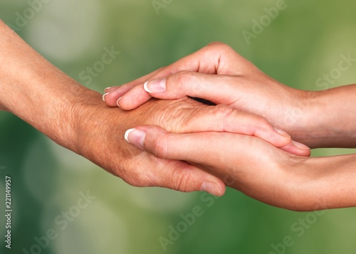 Hands of the old man and a young woman. close up. © BillionPhotos.com
