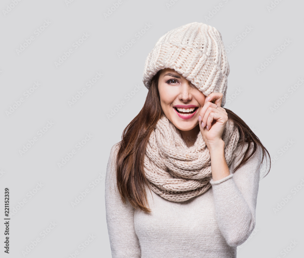 Beautiful woman winter portrait. Smiling girl wearing warm clothes having fun Beautiful woman winter portrait. Smiling girl wearing warm clothes having fun