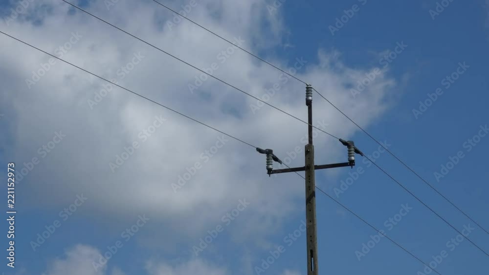 Energy Pole - Passing Clouds and Blue Sky Energy Pole - Passing Clouds and Blue Sky