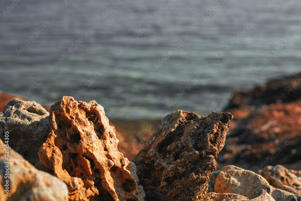 porous stones on the sea