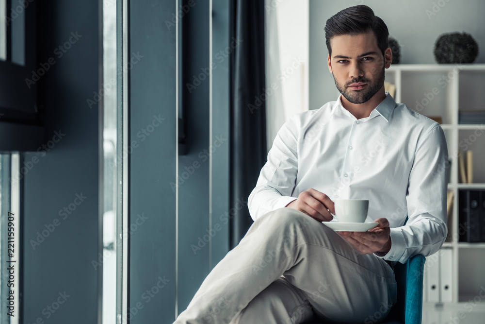 Handsome businessman in office Handsome businessman in office