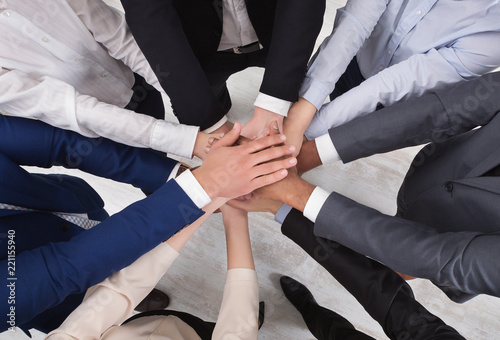 Top view of young business people hands