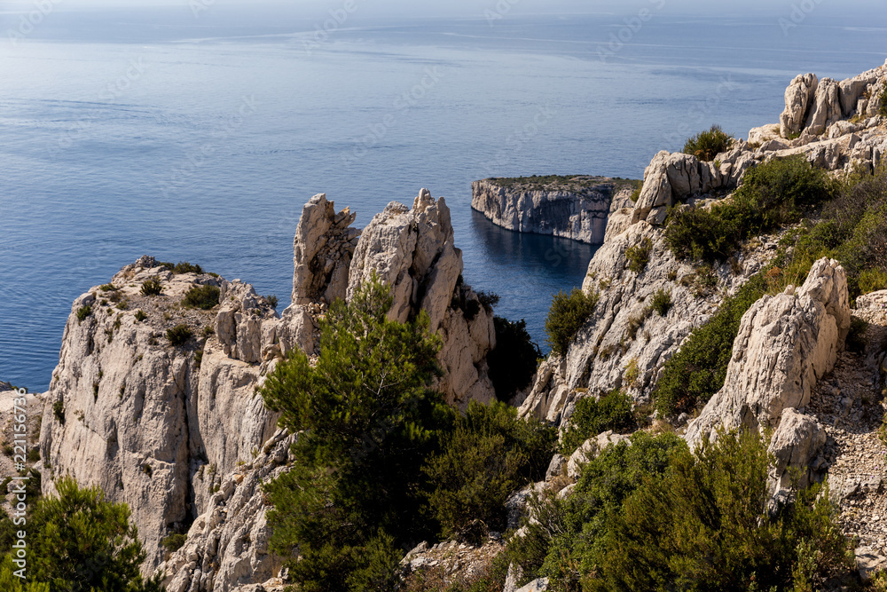 aerial view of high cliffs, green vegetation and calm sea in Calanques de Marseille (Massif des Calanques), provence, france