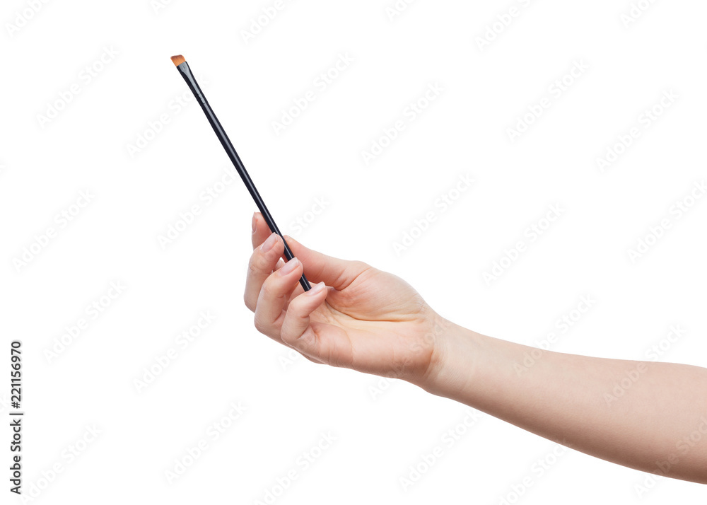 Isolated female hand with brush for makeup Isolated female hand with brush for makeup