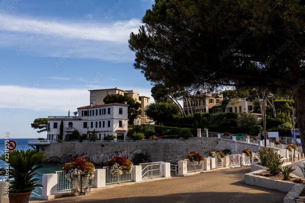 empty embankment and beautiful houses at sea coast in provence, france