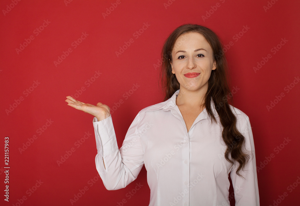 Smiling businesswoman showing open hand palm with copy space for Smiling businesswoman showing open hand palm with copy space for