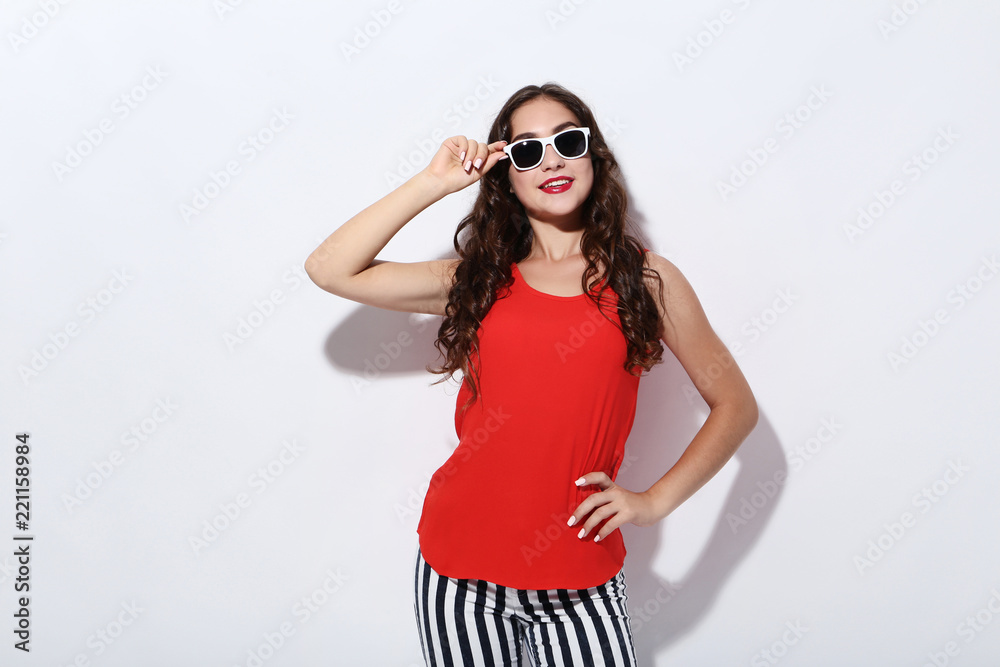 Beautiful woman in fashion clothes on white background