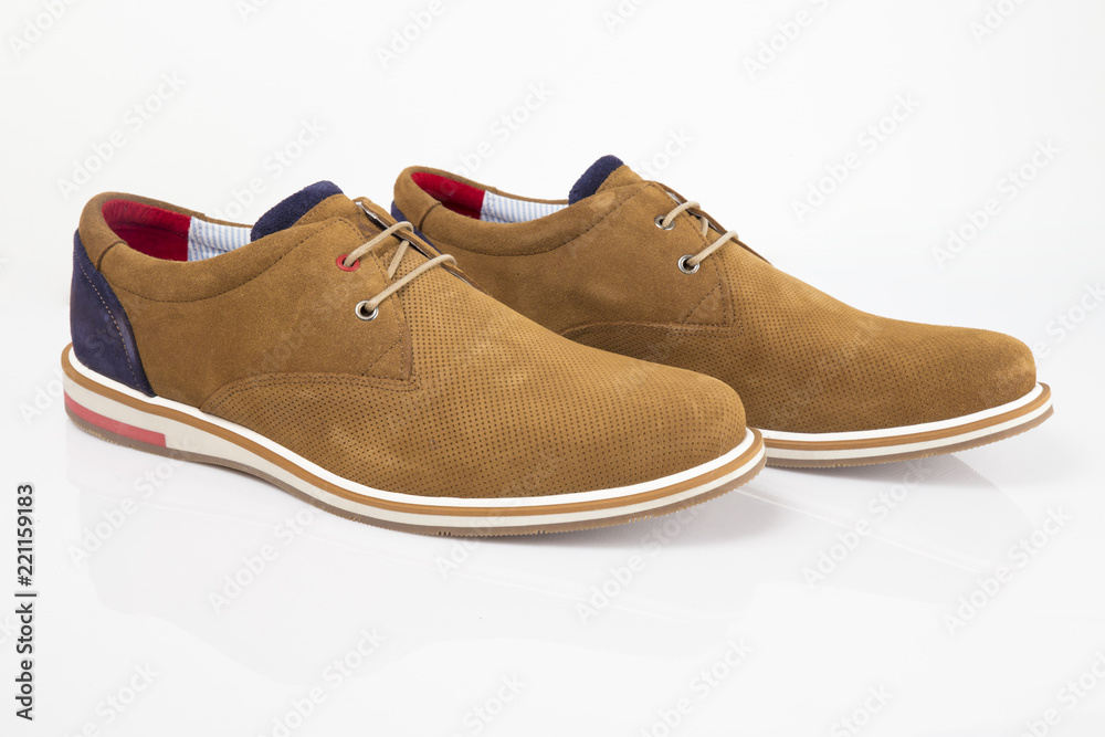 Male brown leather shoe on white background, isolated product, comfortable footwear.