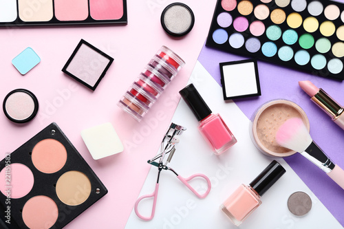 Different makeup cosmetics on background