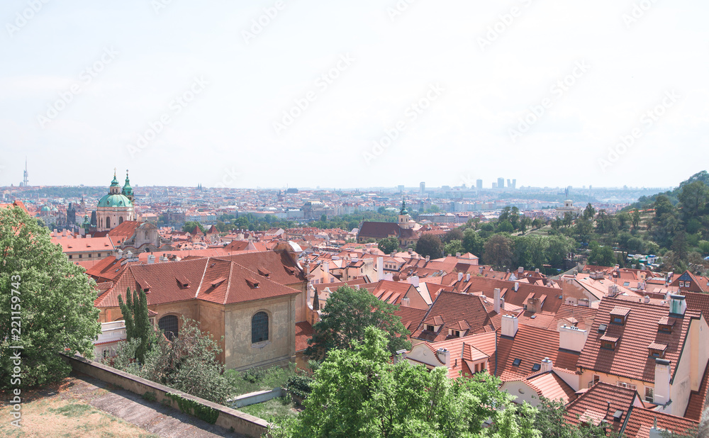 Prague, Czech Republic on a sunny summer day. Landscape of Prague from the observation deck. Beautiful, old, historic city with red tiled roofs top view